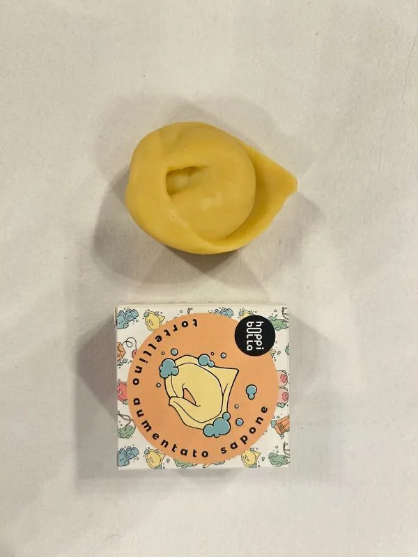 Solid tortellini-shaped soap (yellow) with pink pepper scent